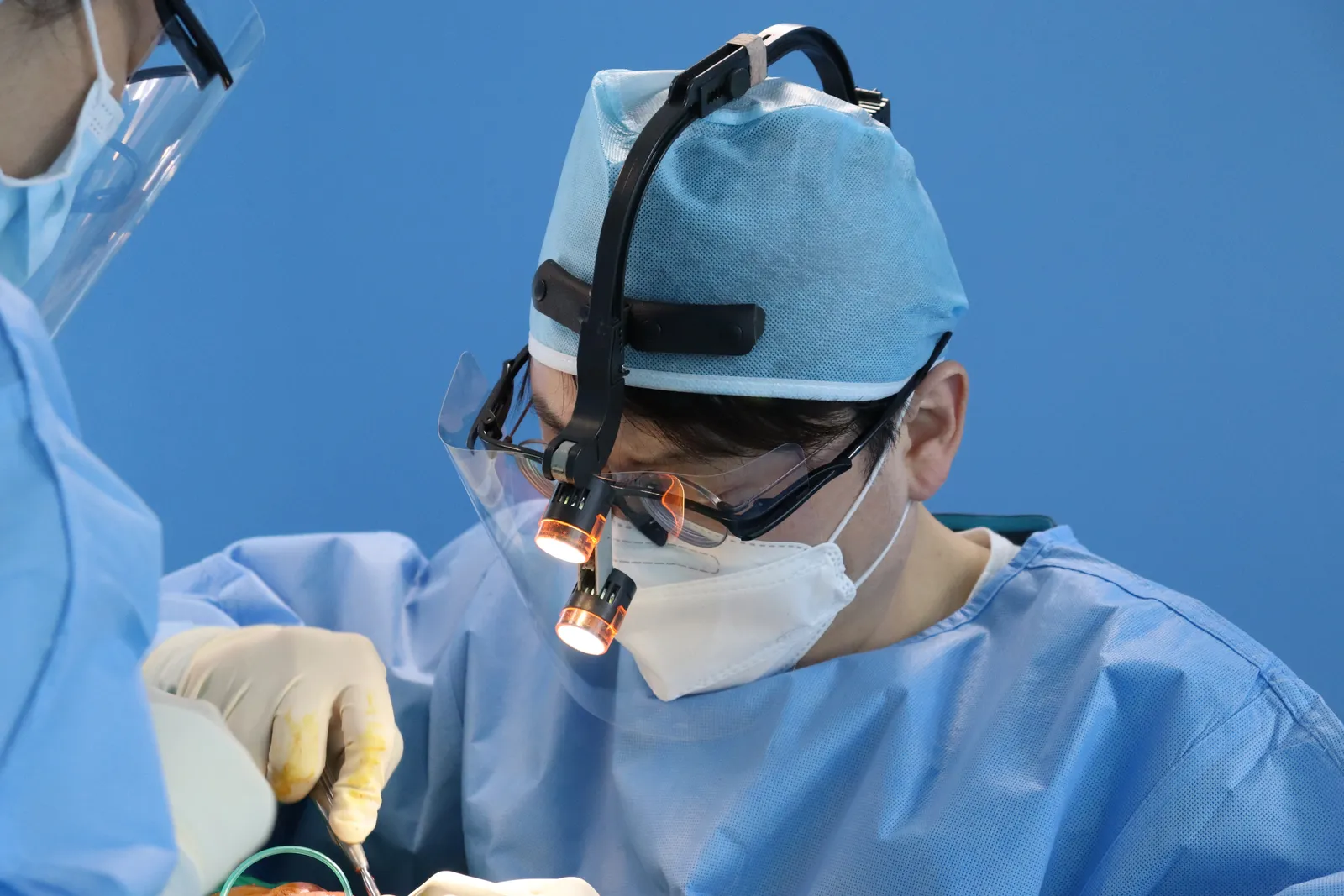 Dr. Peter C. Kang at work in the operating room
